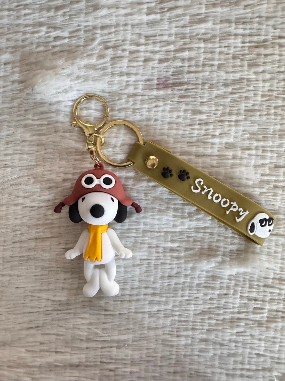 Snoopy keychain with brown hat and yellow scarf super cute